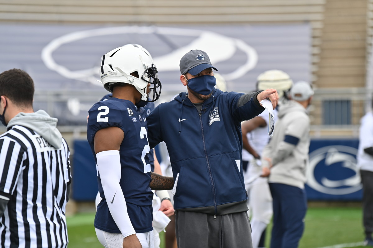 Penn State offensive coordinator Mike Yurcich with quarterback Ta'Quan Roberson during spring drills. (Courtesy Penn State Athletics)